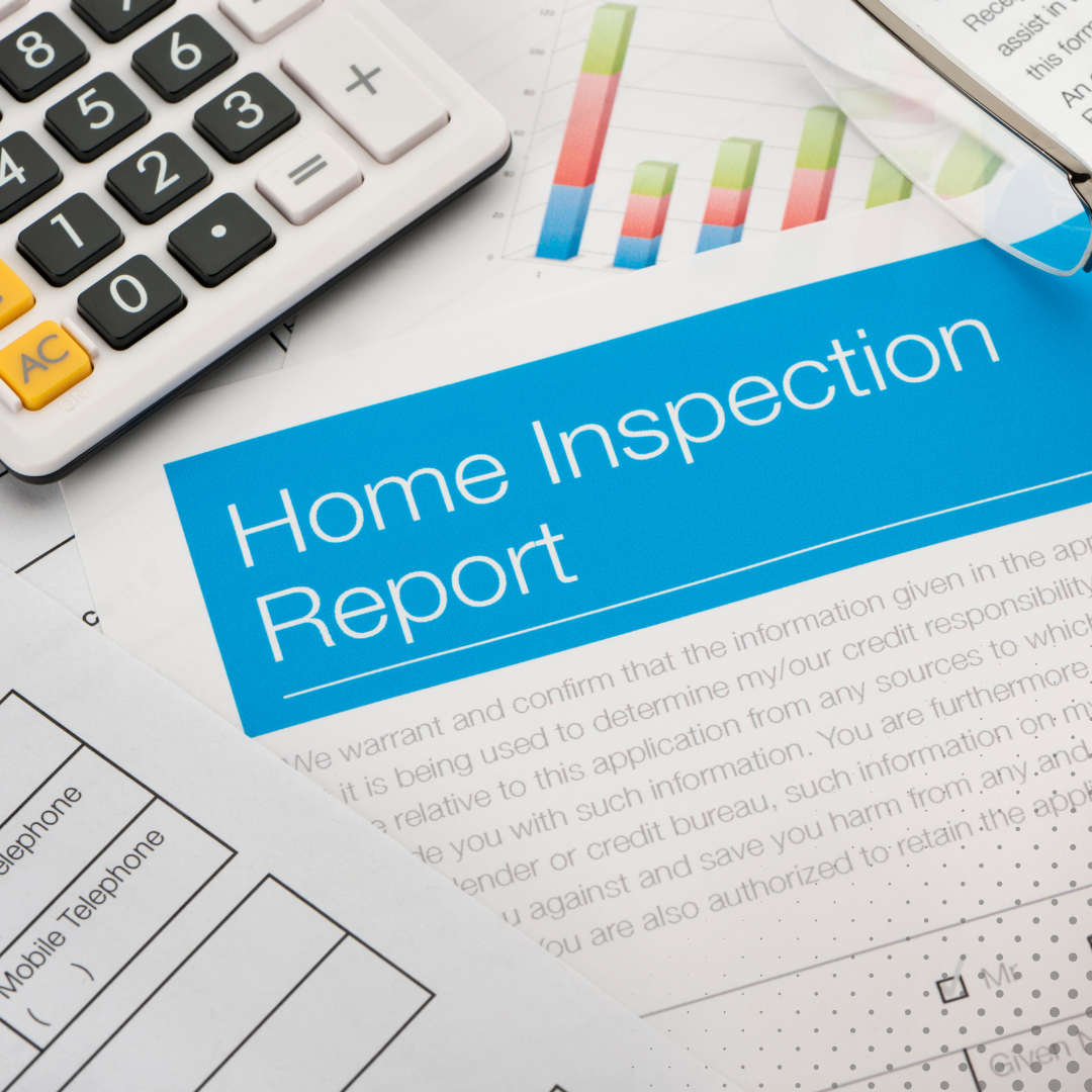 a home inspection report with a calculator, and pen 